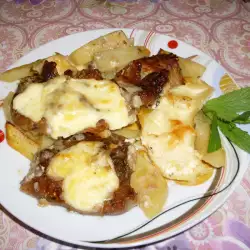 Šnicle u rerni sa krompirom i topljenim sirom